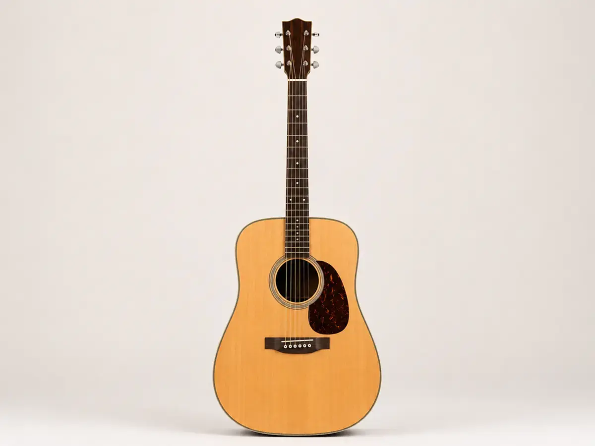 Full body shot of a dreadnought acoustic guitar — large, bass-heavy body