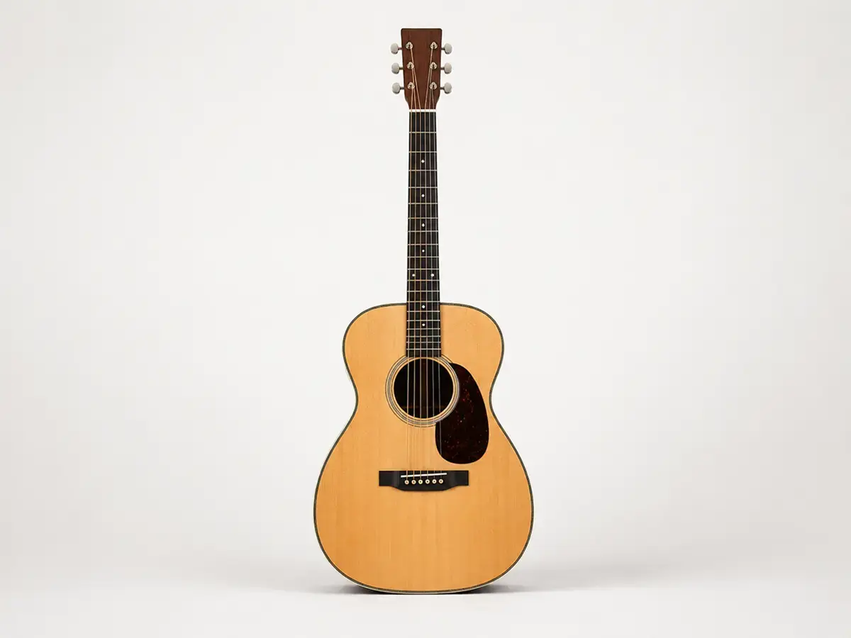Full body shot of an Orchestra Model (OM) acoustic guitar — smaller, balanced body
